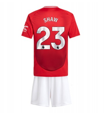 Manchester United Luke Shaw #23 Primera Equipación Niños 2024-25 Manga Corta (+ Pantalones cortos)